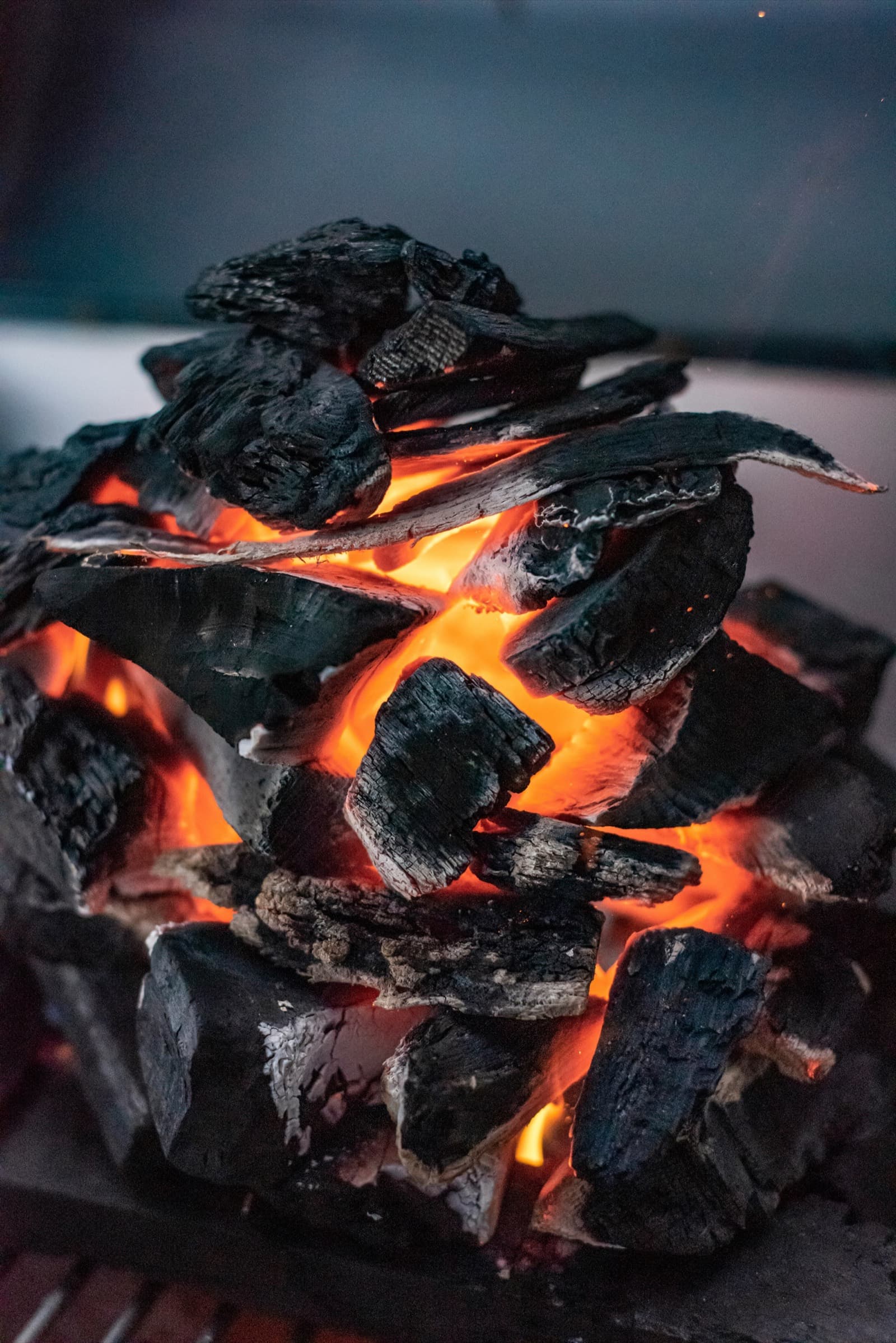 Hands working at a kiln, neutral tones